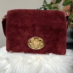 Emma Fox suede leather purse with gold lock closure and extra crossbody strap.